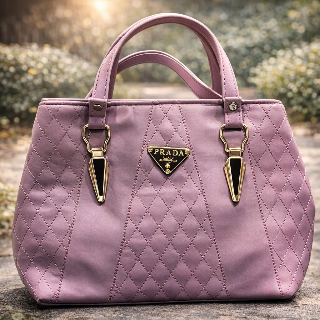 Pink quilted handbag with gold accents | WearCareHub
