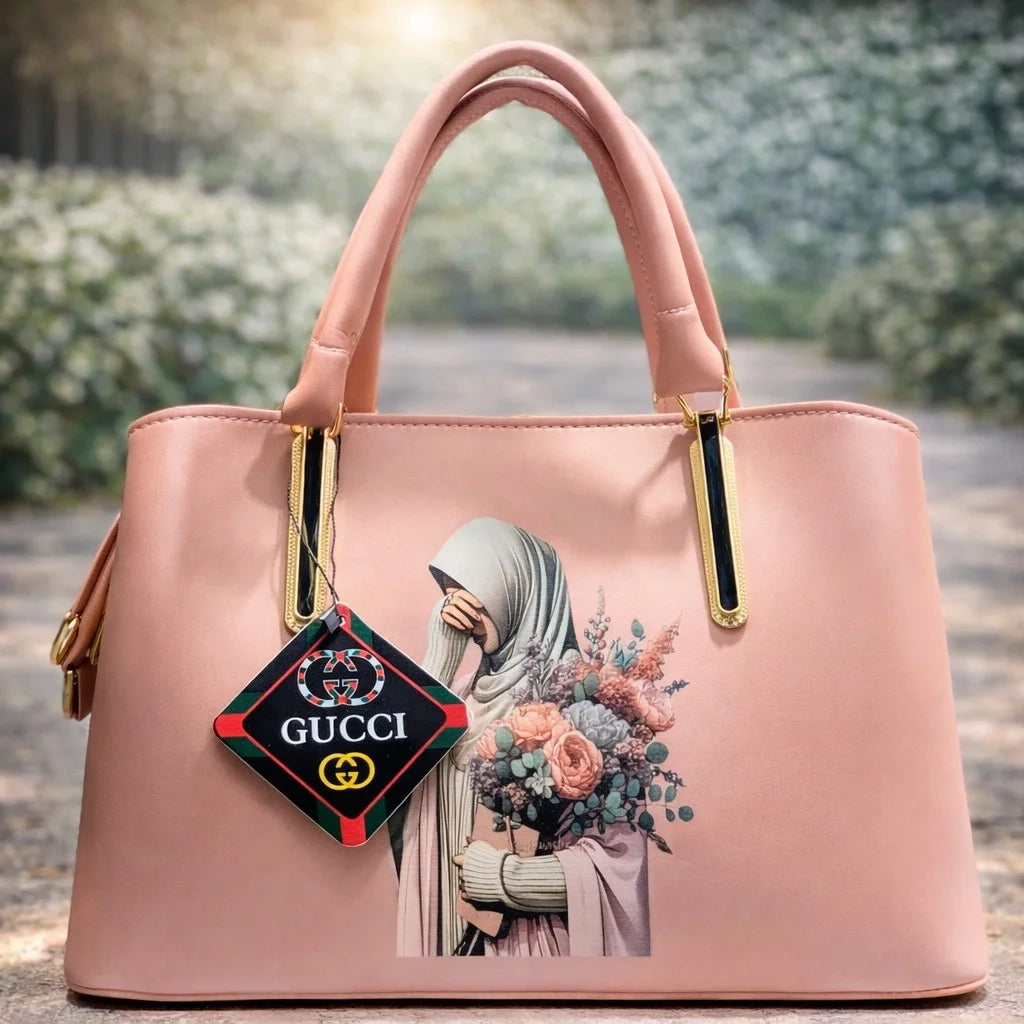 Pink handbag with design of a woman holding flowers | WearCareHub