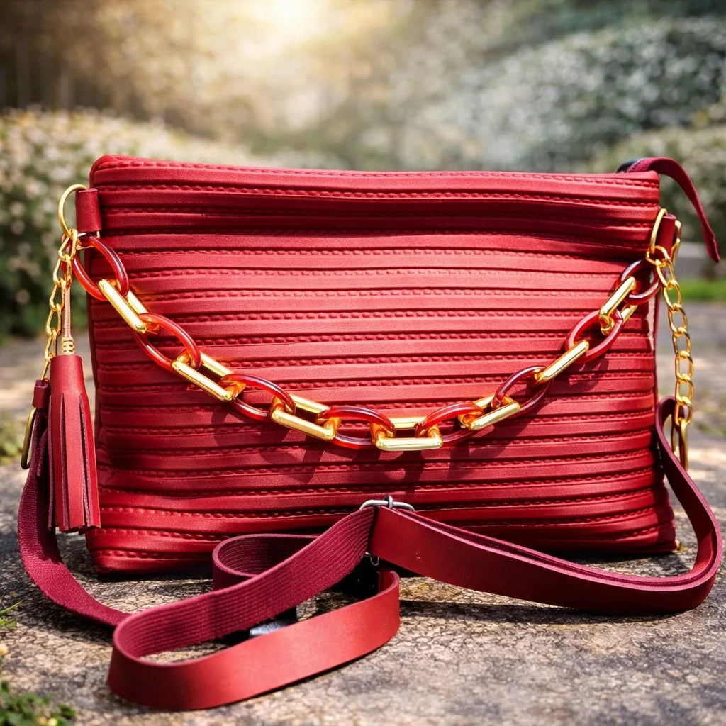 Red handbag with a gold chain strap | WearCareHub