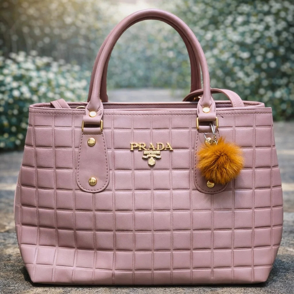 Pink Prada handbag with a yellow pom | WearCareHub