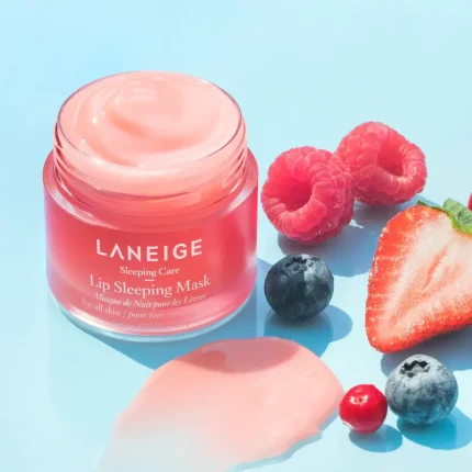 Wake up to irresistibly soft and hydrated lips with the Laneige Lip Sleeping Mask – Berry, a cult-favorite overnight lip care solution. Specially formulated with the exclusive Moisture Wrap™ technology, this lip mask creates a protective layer that locks in moisture and active ingredients throughout the night. Enriched with Berry Mix Complex™, packed with antioxidant-rich raspberry, strawberry, cranberry, and blueberry extracts, it gently exfoliates dead skin cells while delivering intense hydration. The rich, balm-like texture melts effortlessly onto the lips, soothing dryness and restoring natural softness without feeling sticky or heavy. Perfect for daily use, especially in dry or cold weather, this lip sleeping mask is ideal for anyone struggling with cracked or dull lips. Apply a generous layer before bedtime and wake up to healthier, smoother, and more supple lips with a subtle berry fragrance.